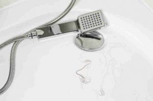 Shower handset in a bathtub