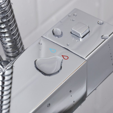 QDSHXDIVCTFFC Bristan Quadrato Safe Touch Chrome Thermostatic Rigid Riser Bar Shower Temperature Button Closeup