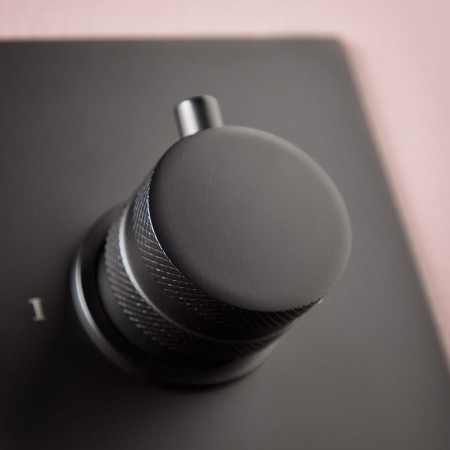 NU-135 Scudo Core Concealed Manual Dual Outlet Shower Valve in Matt Black with Knurled Handle Installed