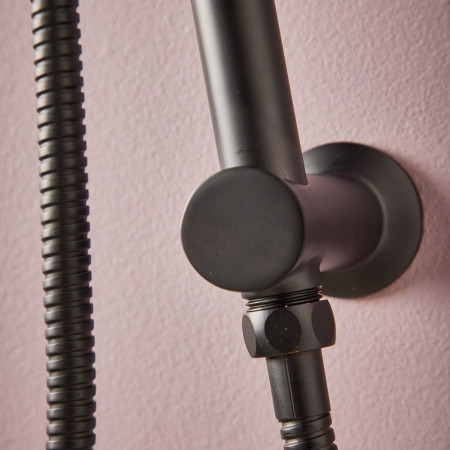 NU-130 Scudo Riser Rail and Handset with Hose in Matt Black Close Up of Wall Fixing and Flex